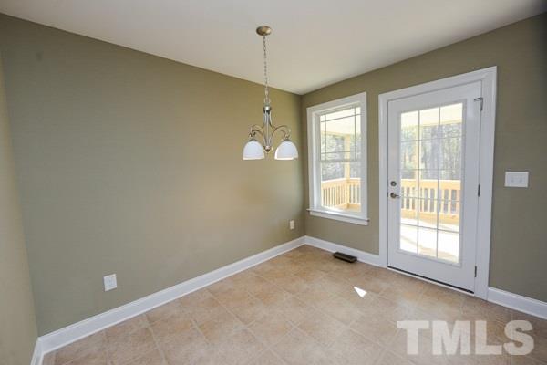 100 Hunters Point Court Angier, NC 27501 - Photo 3 of 13 a view of an empty room with a window