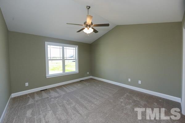 100 Hunters Point Court Angier, NC 27501 - Photo 5 of 13 an empty room with a window and a fan