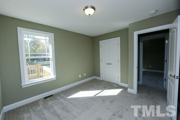 100 Hunters Point Court Angier, NC 27501 - Photo 9 of 13 an empty room with windows