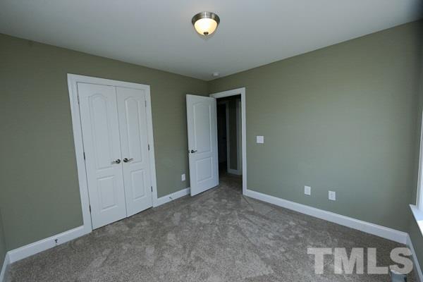100 Hunters Point Court Angier, NC 27501 - Photo 10 of 13 a view of an empty room and window