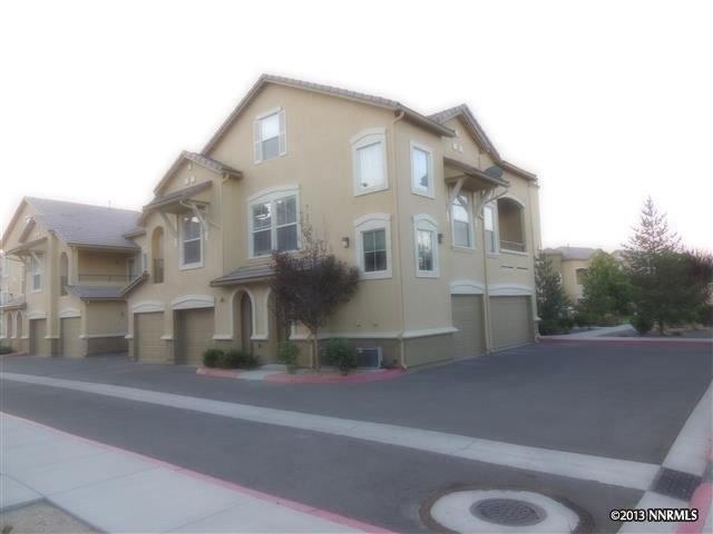 9050 Double R Boulevard, Unit 1421 Reno, NV 89511 - Photo 1 of 1 a front view of a house with a yard
