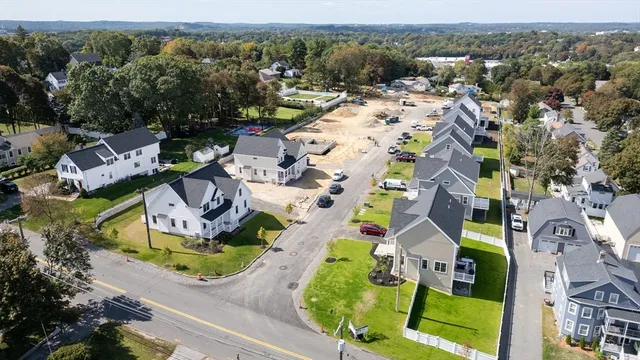 an aerial view of residential houses with outdoor space