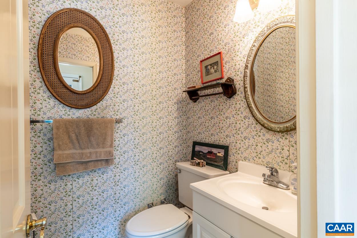 2705 Huntington Road Charlottesville, VA 22901 - Photo 12 of 27 a bathroom with a toilet a sink and a mirror