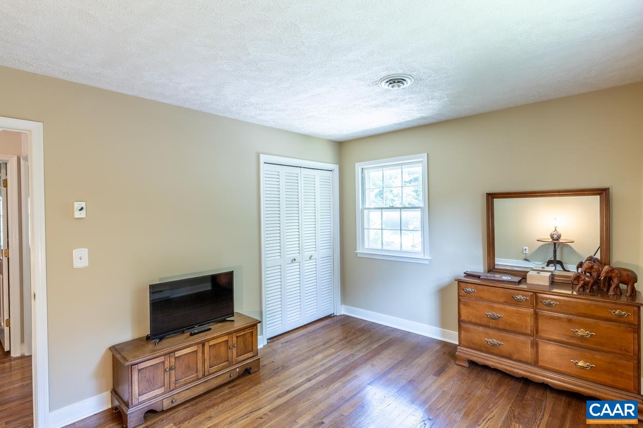 2705 Huntington Road Charlottesville, VA 22901 - Photo 14 of 27 a room with furniture flat screen tv and a window