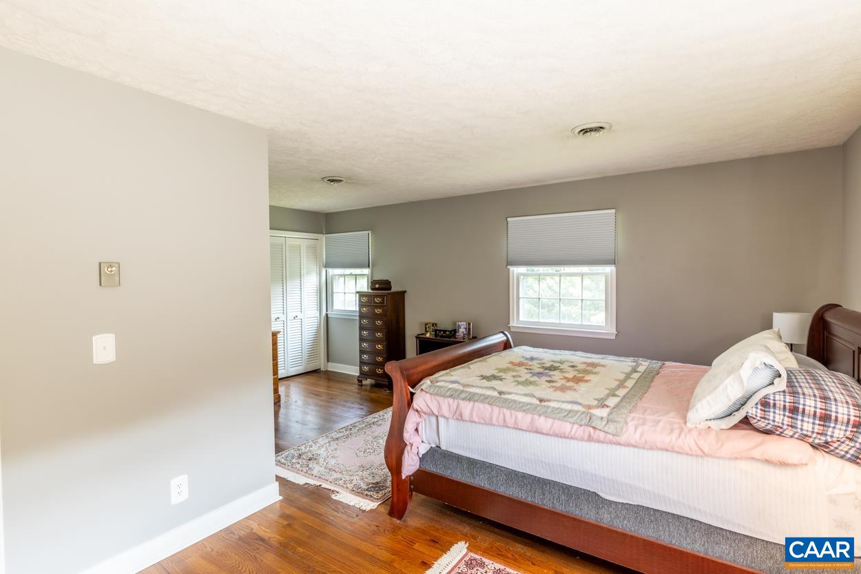 2705 Huntington Road Charlottesville, VA 22901 - Photo 17 of 27 a bedroom with a bed and a view of kitchen