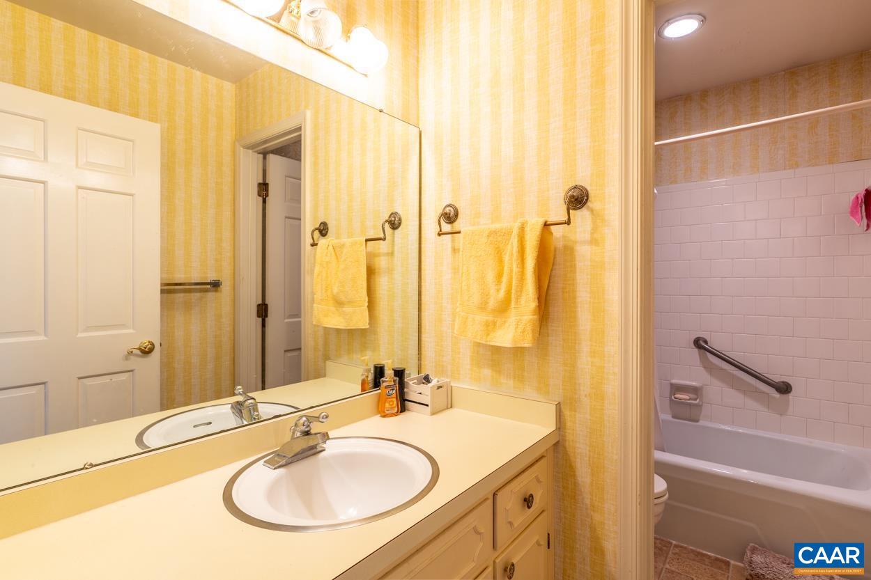 2705 Huntington Road Charlottesville, VA 22901 - Photo 18 of 27 a bathroom with a sink and a mirror