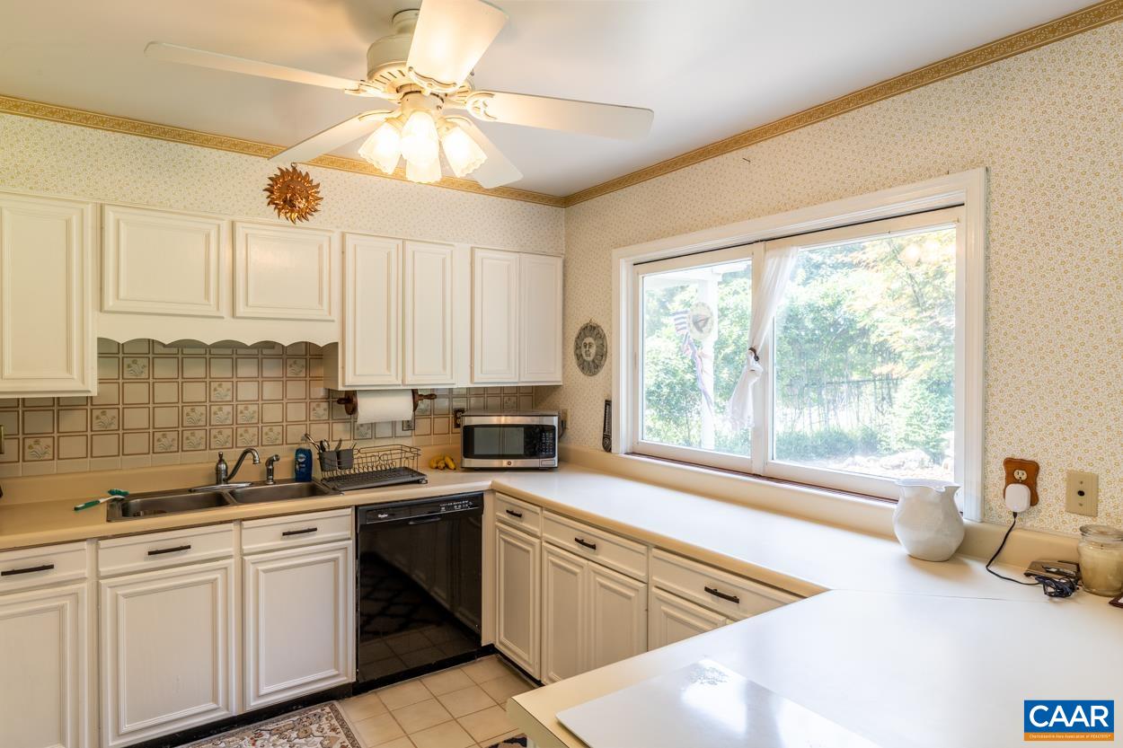 2705 Huntington Road Charlottesville, VA 22901 - Photo 8 of 27 a kitchen with a window a sink and cabinets