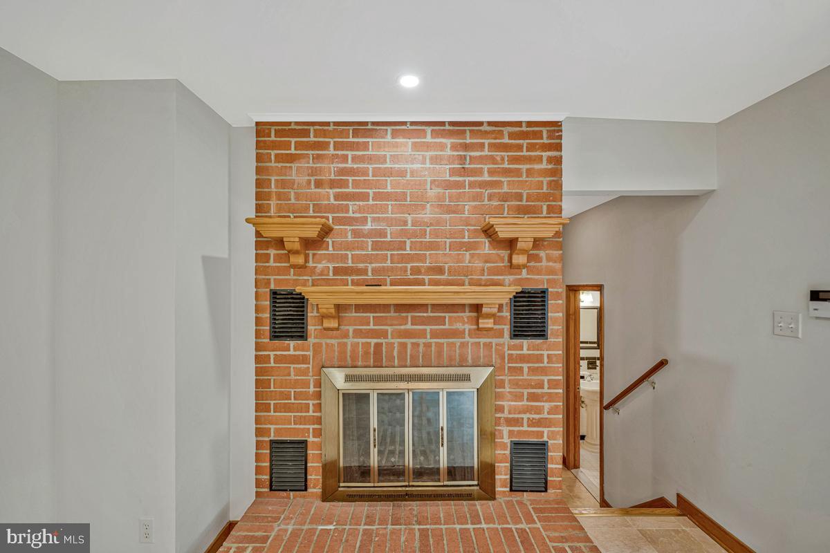 7185 Hawthorne Road La Plata, MD 20646 - Photo 23 of 59 Charming brick fireplace centerpiece.