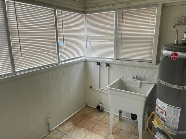 a bathroom with a sink and a window