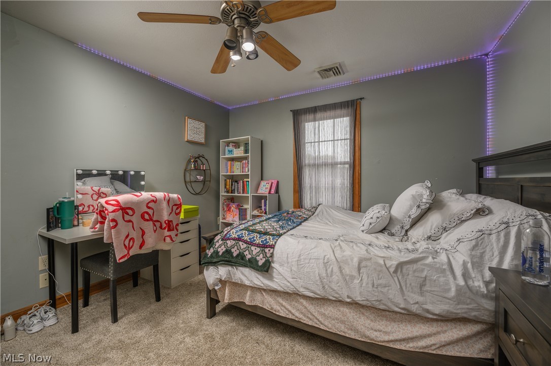 806 Forrest Ridge Drive Dover, OH 44622 - Photo 28 of 36 Bedroom with light carpet and ceiling fan