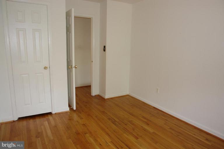 7014 Leestone Street Springfield, VA 22151 - Photo 11 of 23 a view of an empty room with wooden floor