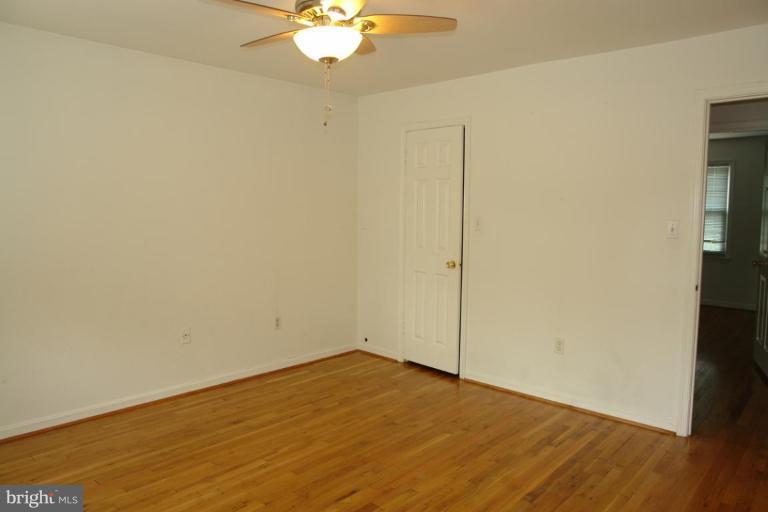 7014 Leestone Street Springfield, VA 22151 - Photo 16 of 23 wooden floor in an empty room