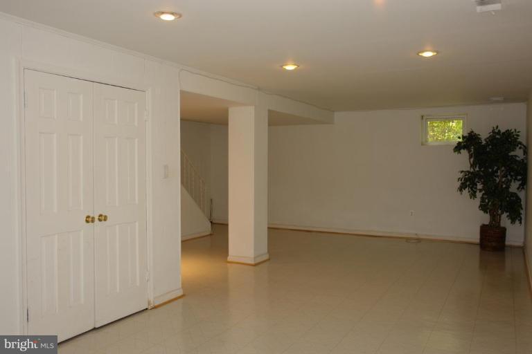 7014 Leestone Street Springfield, VA 22151 - Photo 19 of 23 wooden floor in an empty room with a window