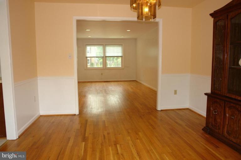 7014 Leestone Street Springfield, VA 22151 - Photo 23 of 23 an empty room with wooden floor and a window