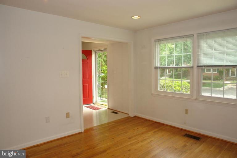 7014 Leestone Street Springfield, VA 22151 - Photo 5 of 23 an empty room with wooden floor and windows