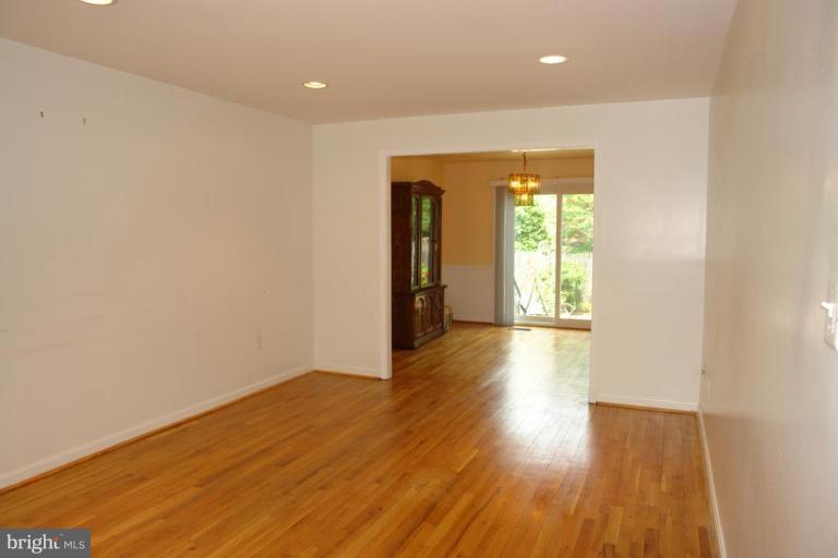 7014 Leestone Street Springfield, VA 22151 - Photo 8 of 23 wooden floor in an empty room with a window