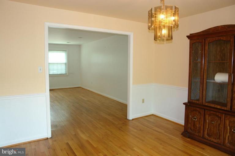 7014 Leestone Street Springfield, VA 22151 - Photo 9 of 23 wooden floor in an empty room