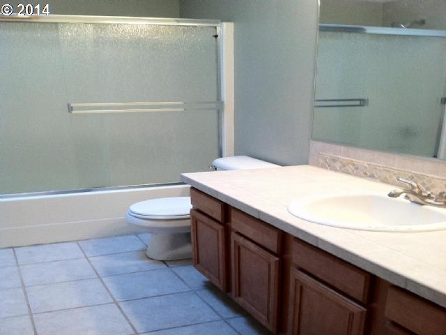 620 Southwest Trout Court Camas, WA 98607 - Photo 8 of 8 a bathroom with a sink a toilet and a shower