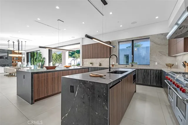a kitchen with a sink stove and cabinets