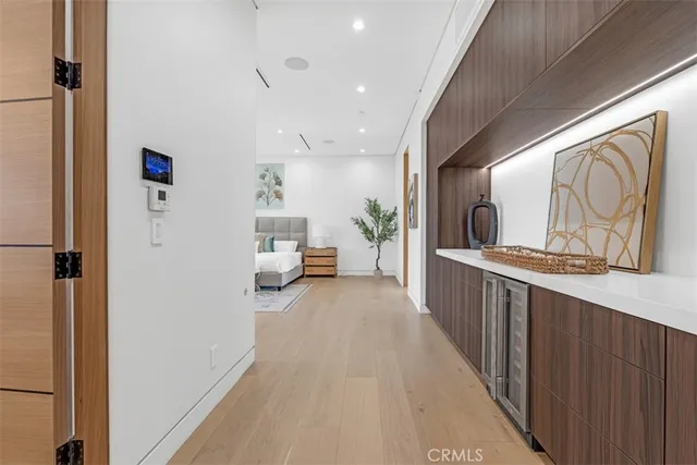 a bedroom with a bed and a television