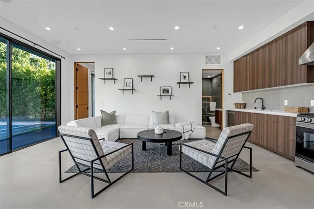 a view of a roof deck with couches and sky view