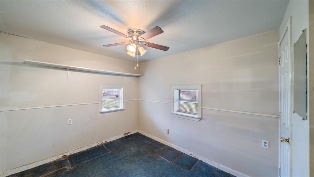 120 Davis Road Combine, TX 75159 - Photo 13 of 35 an empty room with windows and fan