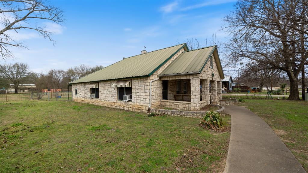 120 Davis Road Combine, TX 75159 - Photo 2 of 35 a house with trees in the background
