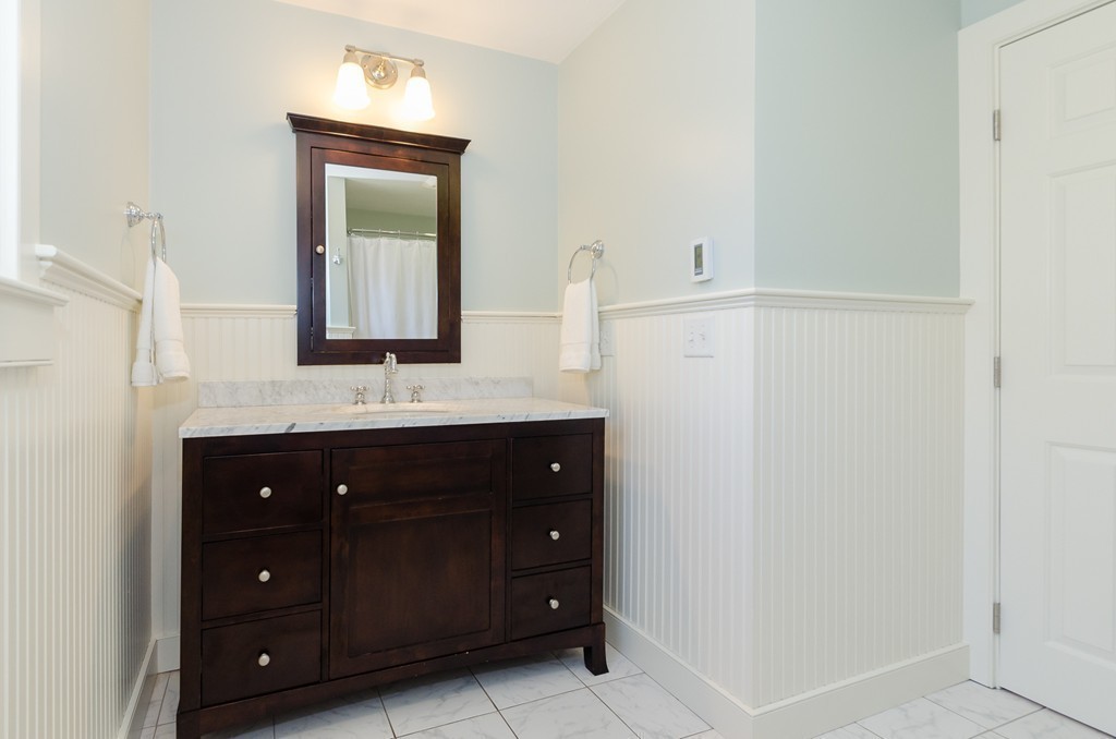 7 Ridgewood Lane Marion, MA 02738 - Photo 16 of 24 a bathroom with a sink vanity and a mirror