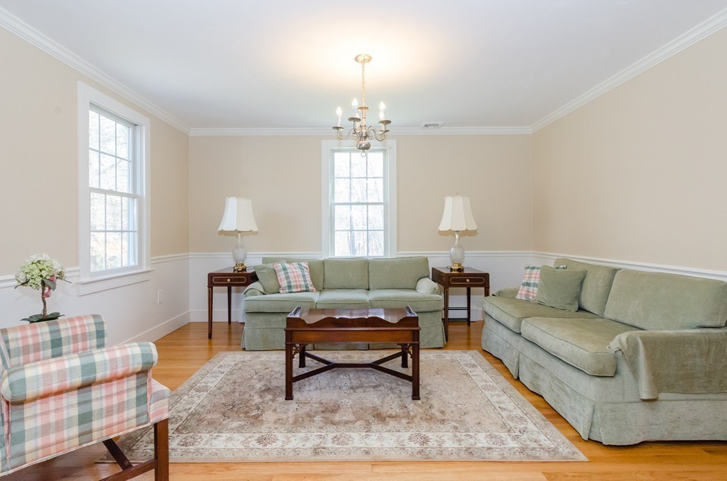 7 Ridgewood Lane Marion, MA 02738 - Photo 9 of 24 a living room with furniture and a potted plant