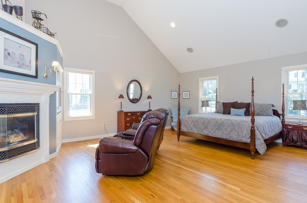 7 Ridgewood Lane Marion, MA 02738 - Photo 10 of 24 a bedroom with a bed and a fireplace