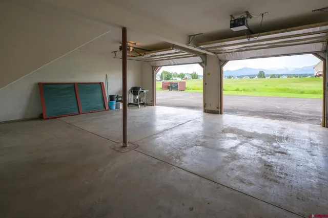 a bathroom with a sink mirror and toilet