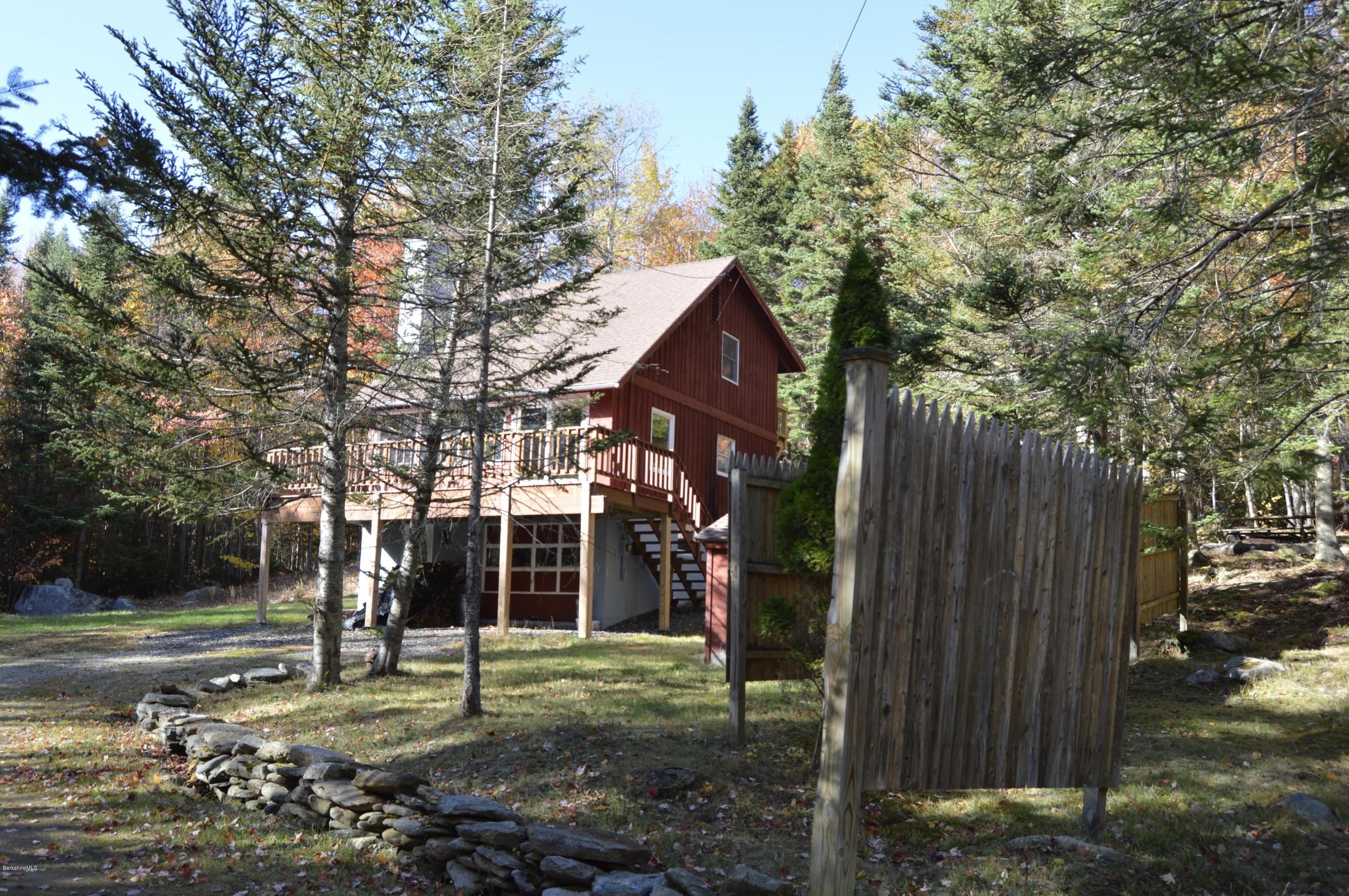 25 Davis Road Monroe, MA 01350 - Photo 1 of 27 a backyard of a house with lots of green space