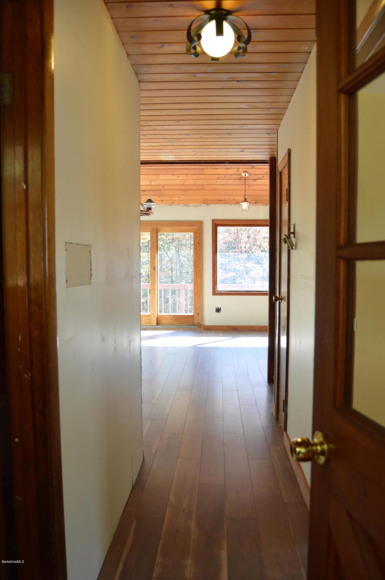 25 Davis Road Monroe, MA 01350 - Photo 15 of 27 an empty room with wooden floor and windows