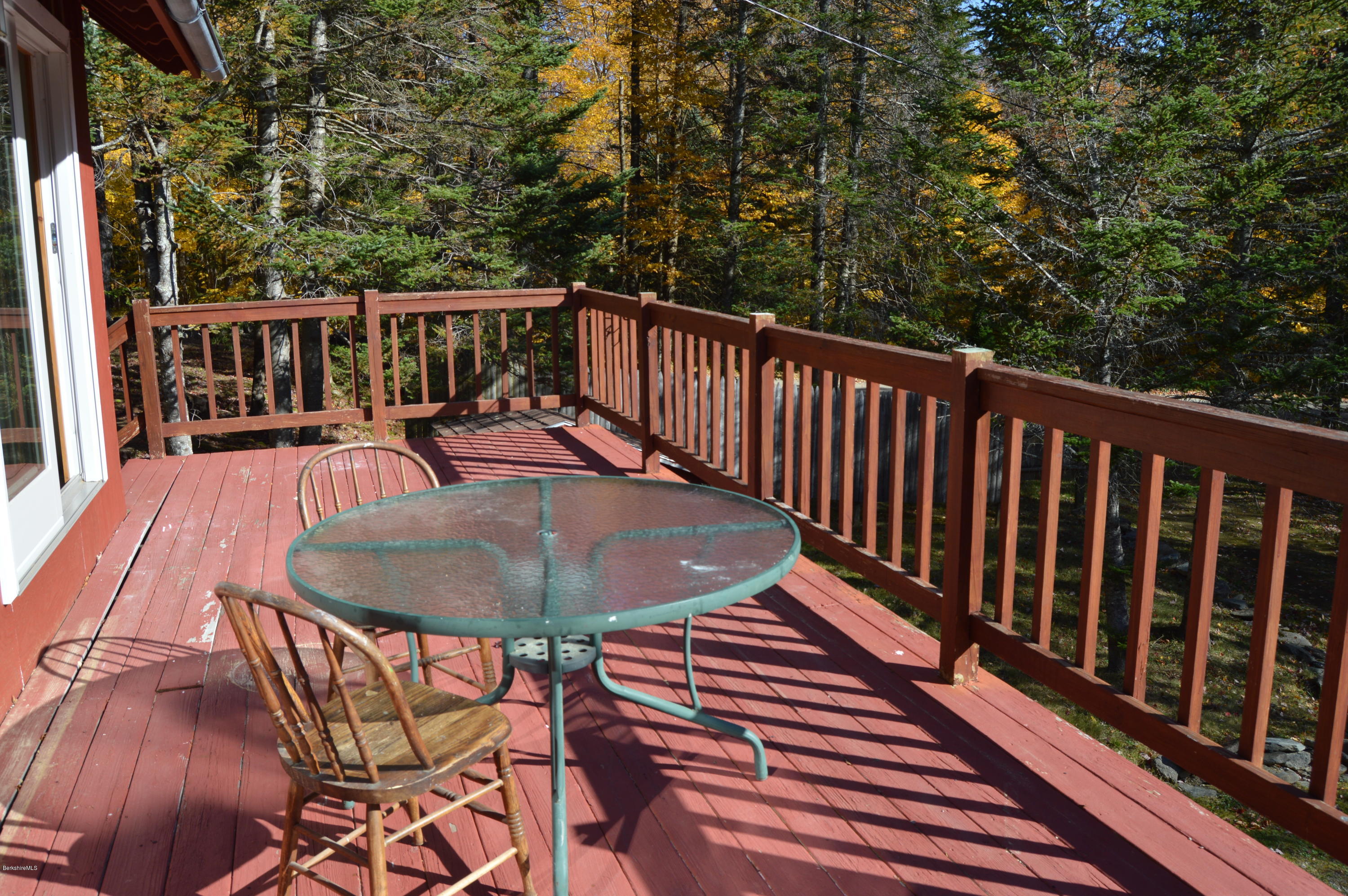 25 Davis Road Monroe, MA 01350 - Photo 20 of 27 a balcony with table and chairs