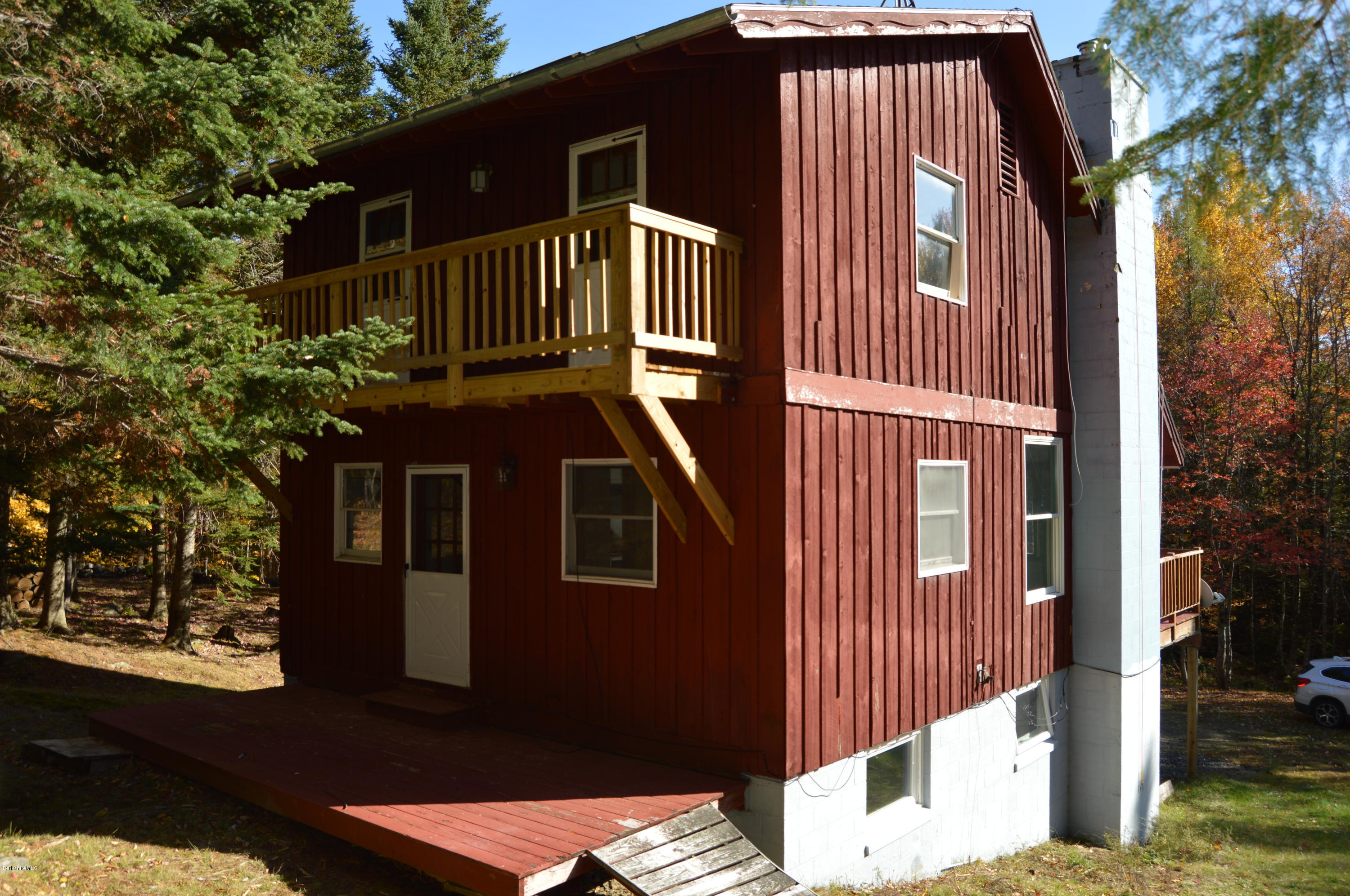 25 Davis Road Monroe, MA 01350 - Photo 5 of 27 a front view of a house with a balcony