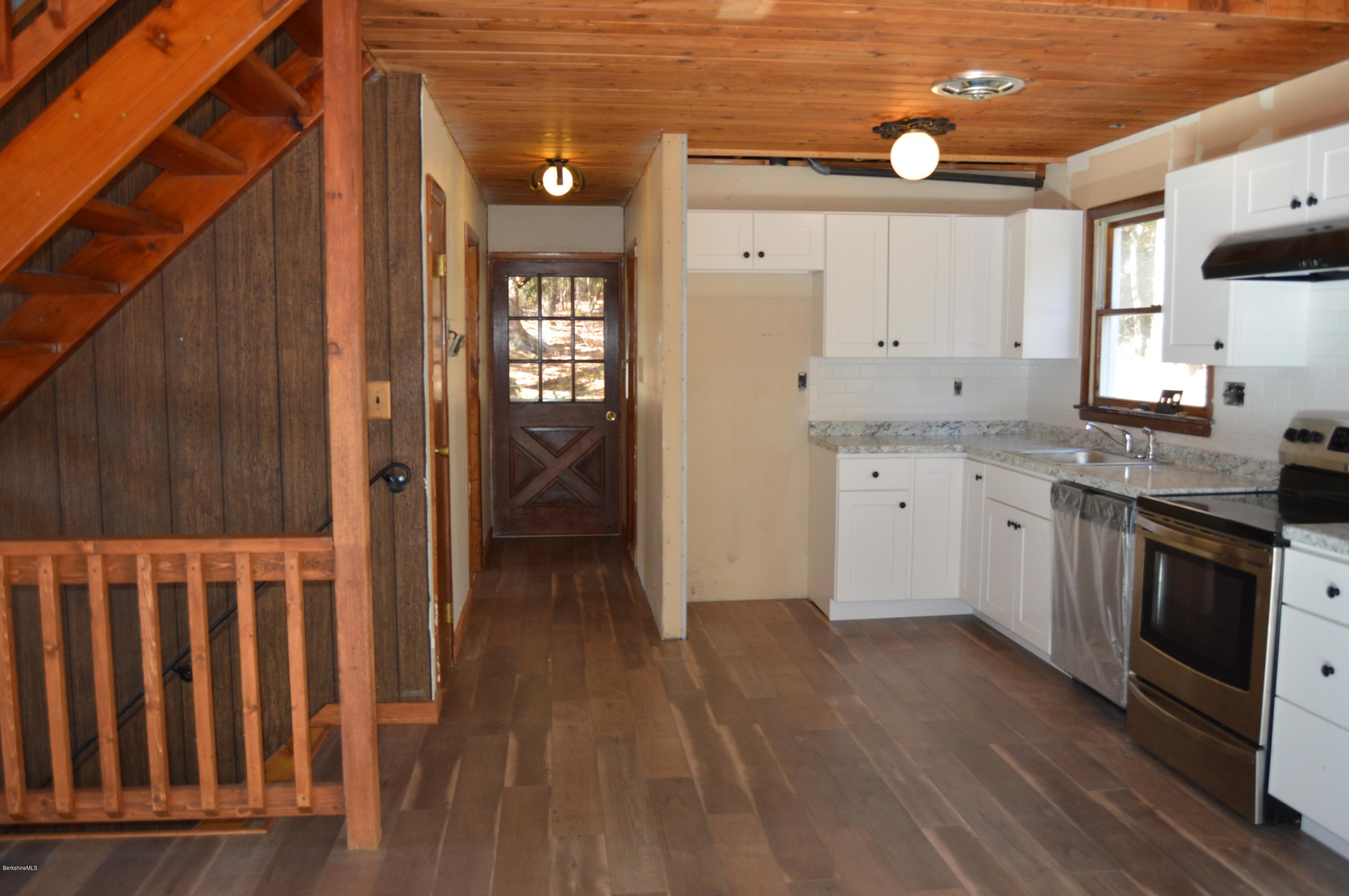 25 Davis Road Monroe, MA 01350 - Photo 10 of 27 a kitchen with a sink cabinets and wooden floor