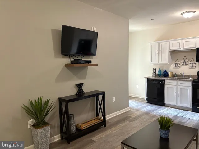 a kitchen with a sink and a stove top oven