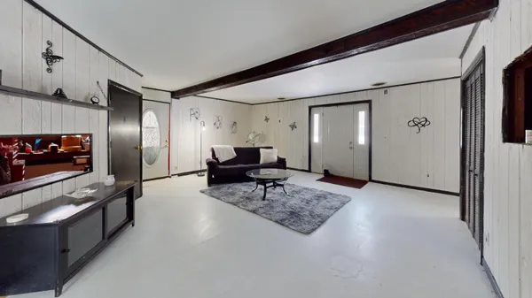 a view of entryway with wooden floor and stairs