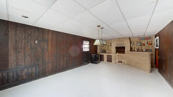 a dining room with furniture and a window