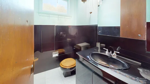 a kitchen with stainless steel appliances granite countertop a sink refrigerator and cabinets