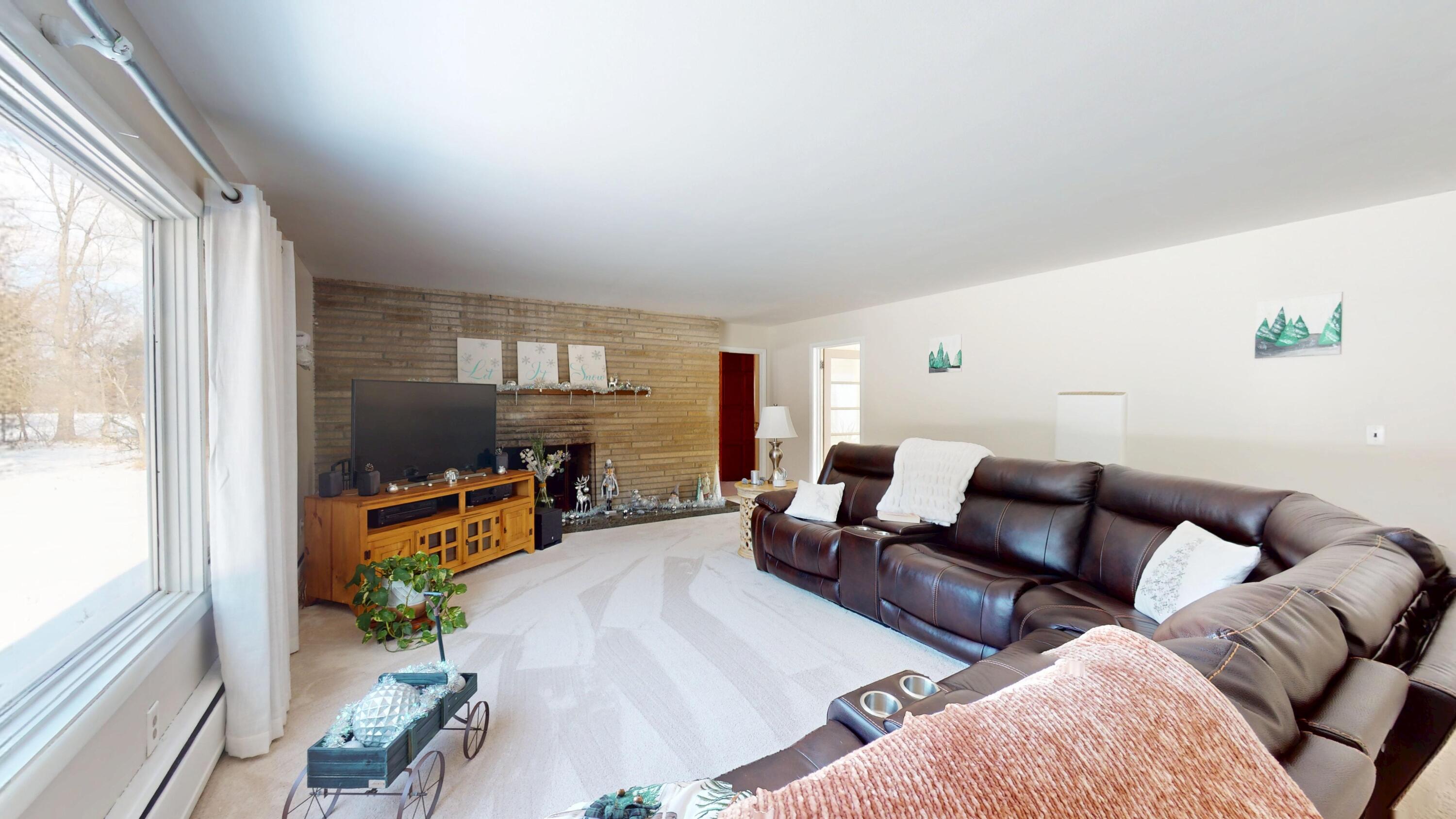 2240 South 350 East Knox, IN 46534 - Photo 33 of 103 a living room with furniture and a flat screen tv