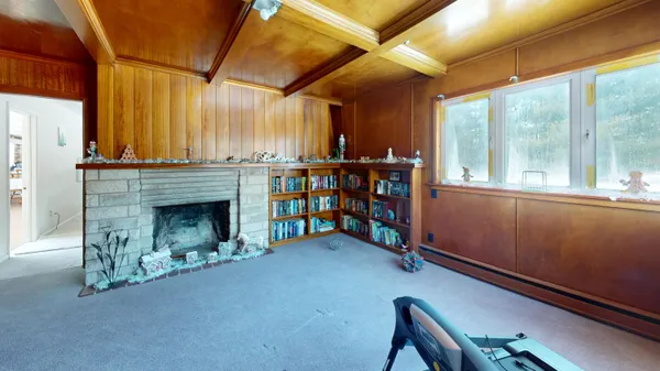 a view of a room with window and wooden floor