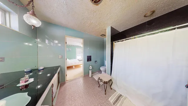 a view of snow on the side of a road