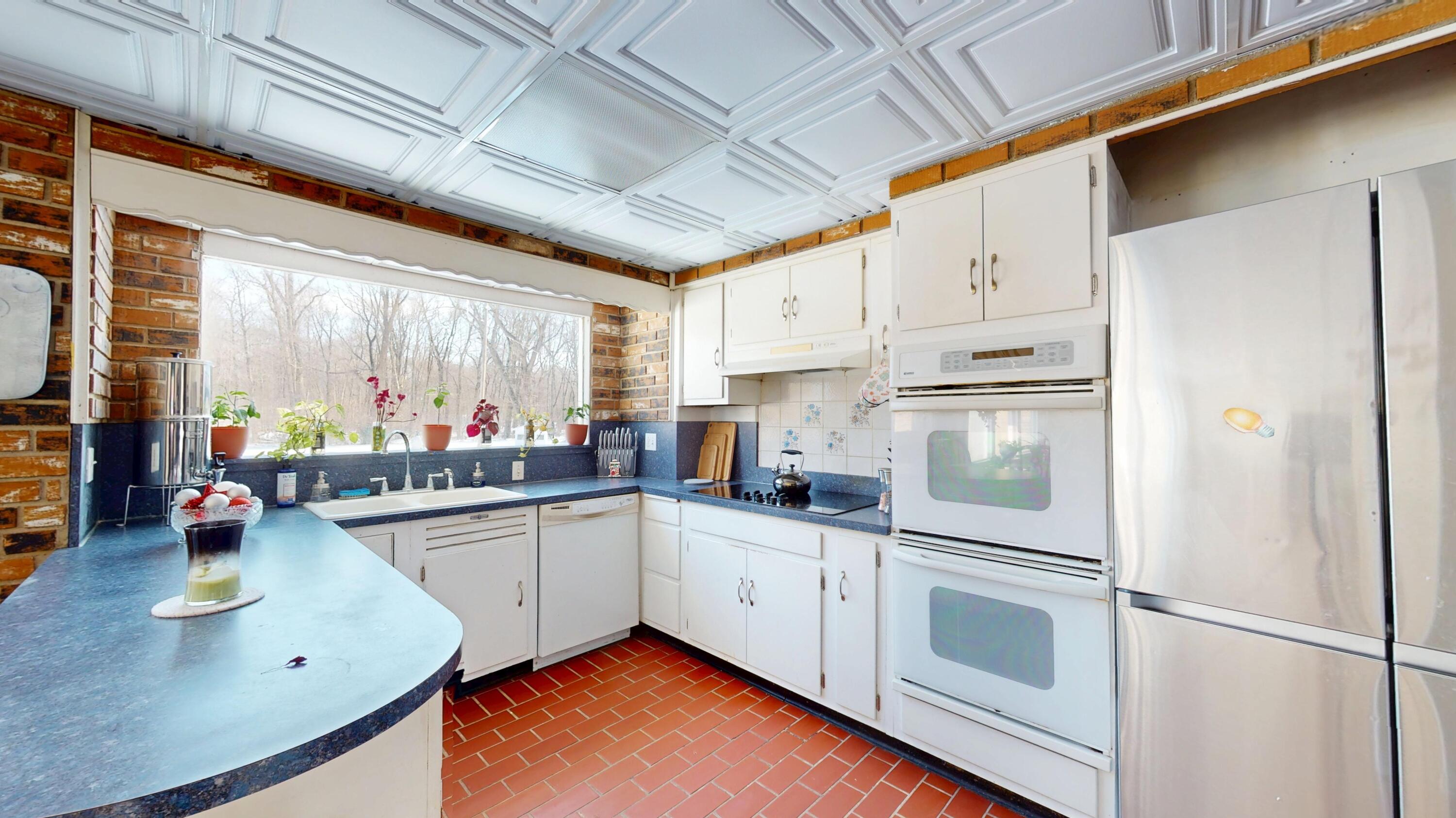 2240 South 350 East Knox, IN 46534 - Photo 58 of 103 a kitchen with stainless steel appliances granite countertop a sink refrigerator and cabinets