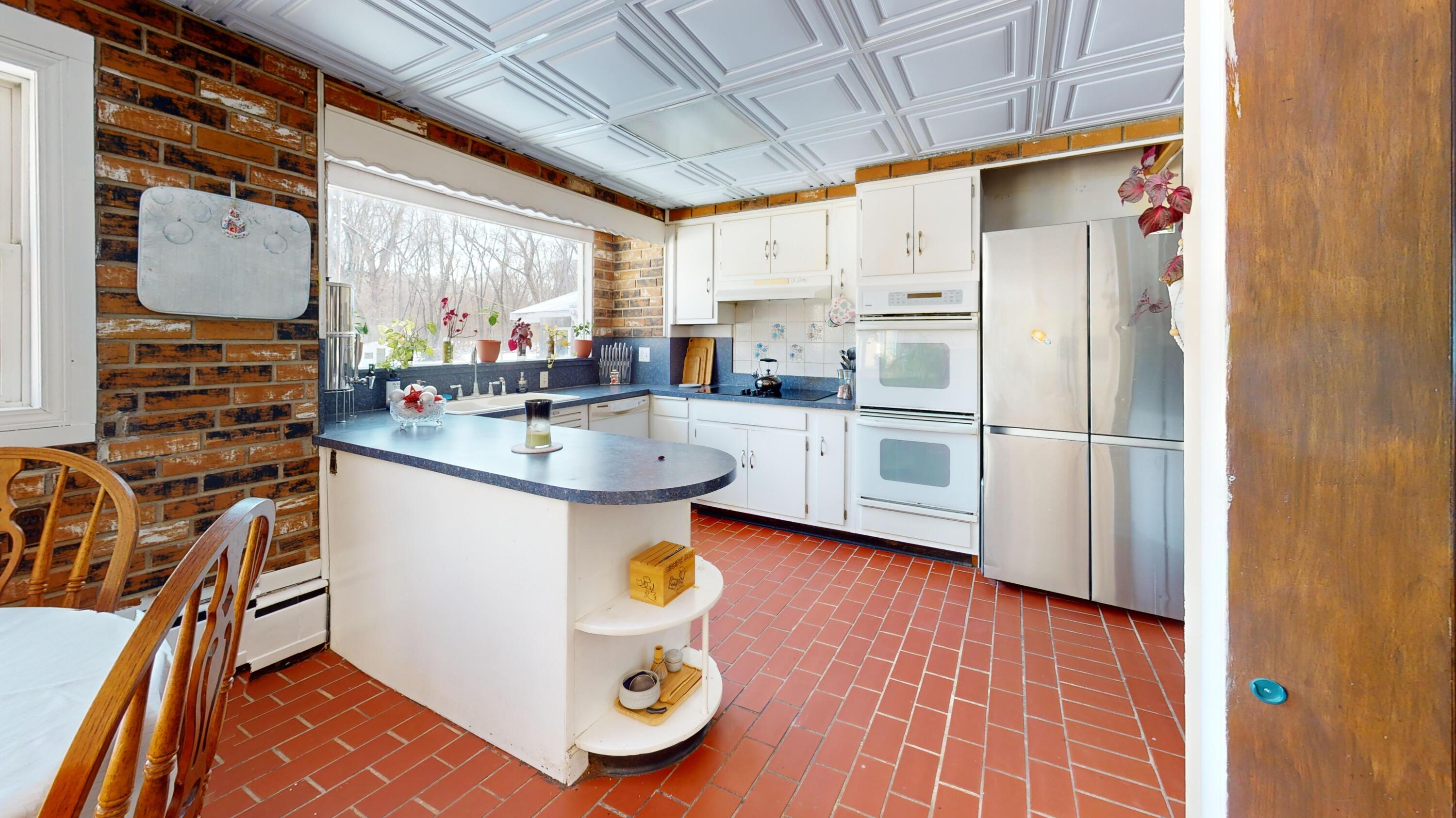 2240 South 350 East Knox, IN 46534 - Photo 63 of 103 a kitchen with stainless steel appliances granite countertop a sink refrigerator and cabinets
