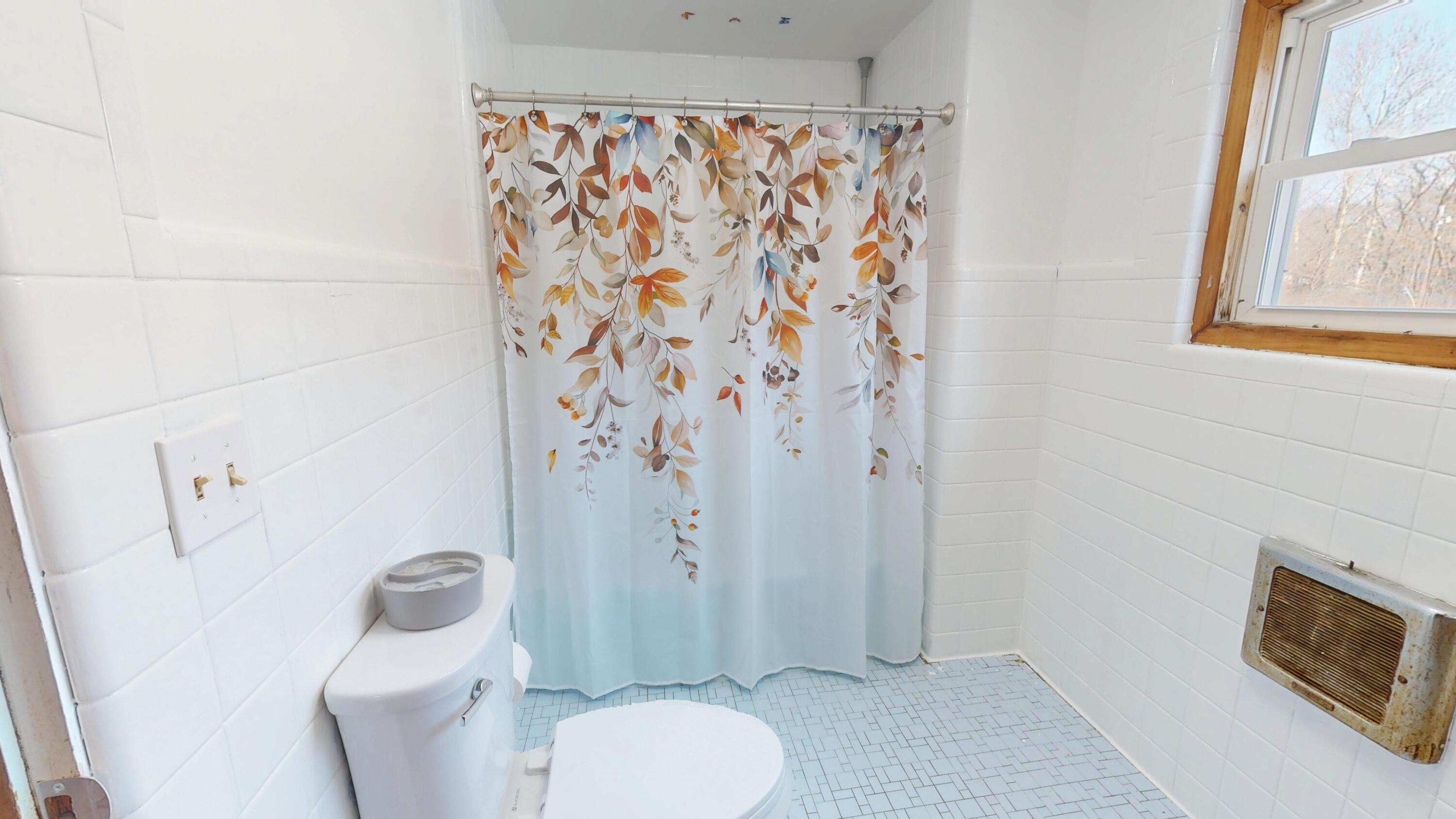 2240 South 350 East Knox, IN 46534 - Photo 64 of 103 a white toilet sitting next to a bathroom sink