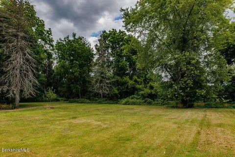 a view of a swimming pool and an outdoor space