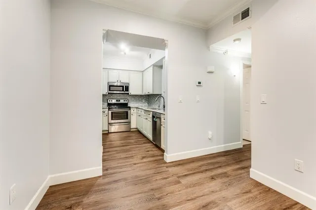 a view of kitchen and wooden floor