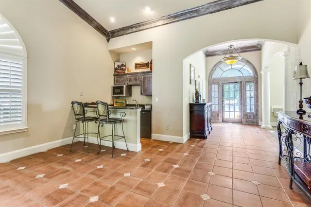 a view of a entryway door and an empty room