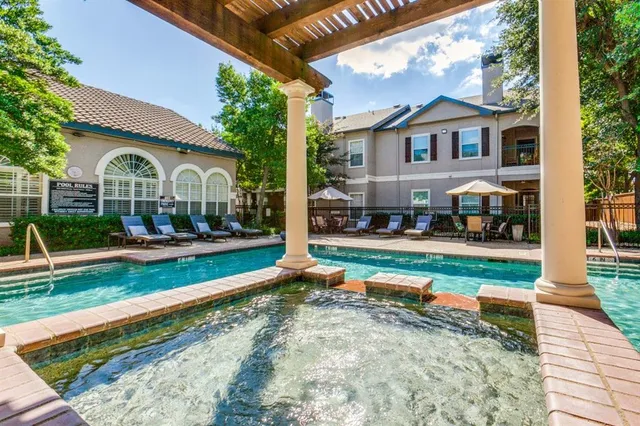 a front view of a house with a yard table and chairs